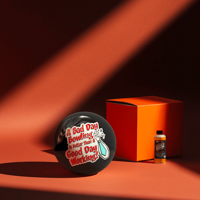 Hands holding a red orb with intricate, patterned artwork depicting a figure with sunglasses.