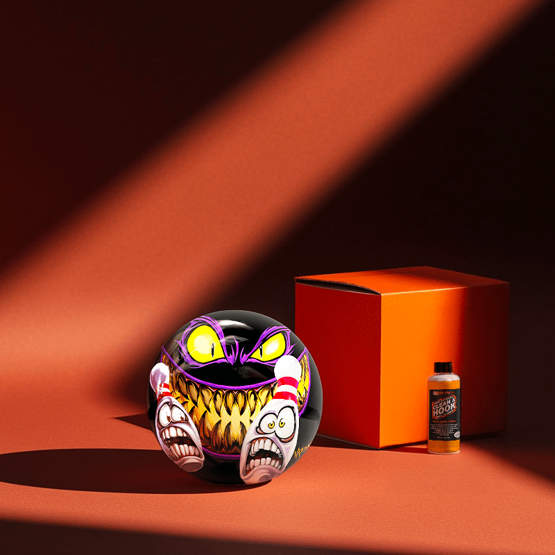 Hands holding a red orb with intricate, patterned artwork depicting a figure with sunglasses.