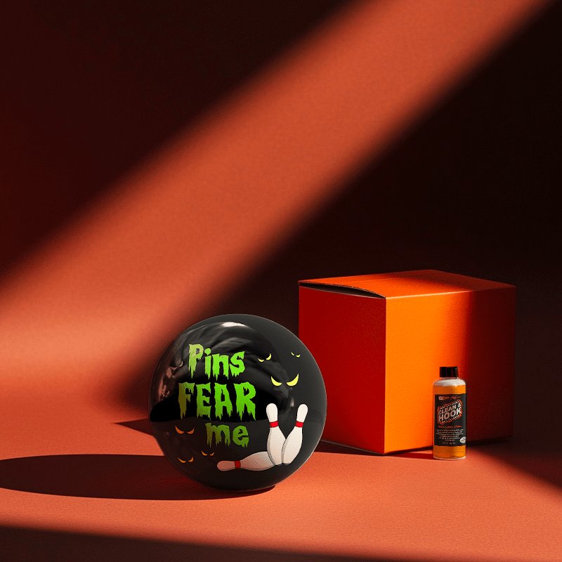 Hands holding a red orb with intricate, patterned artwork depicting a figure with sunglasses.