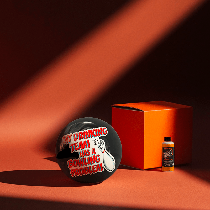 Hands holding a red orb with intricate, patterned artwork depicting a figure with sunglasses.