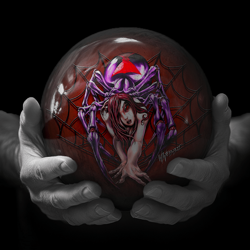 Hands holding a red sphere featuring a floral-patterned figure.