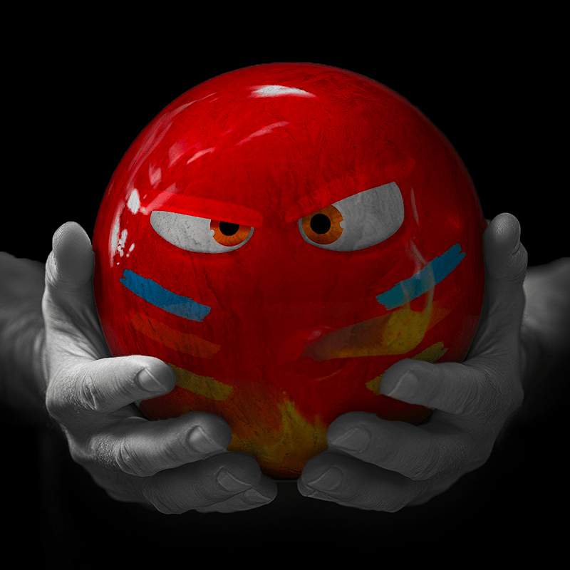 Hands holding a red sphere featuring a floral-patterned figure.