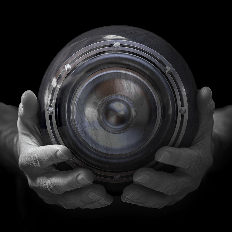 Hands holding a red sphere featuring a floral-patterned figure.