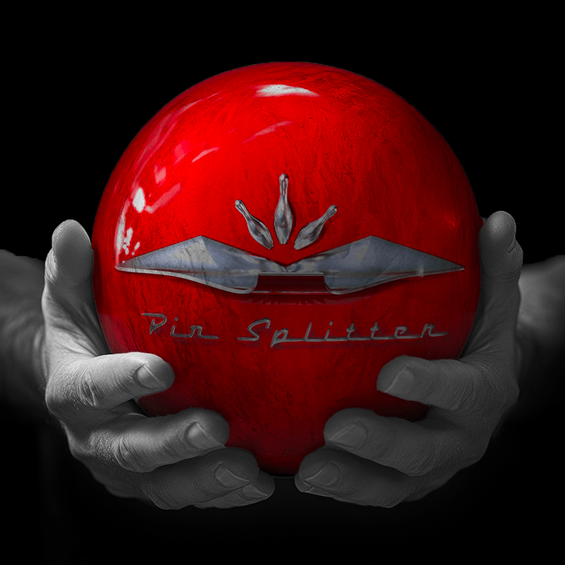 Hands holding a red sphere featuring a floral-patterned figure.